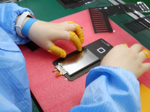 Victronix technician assembling a real TFT LCD module with visible FPC cable